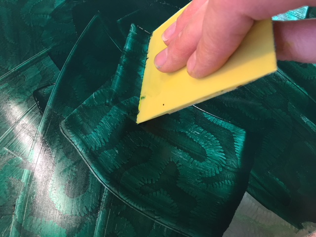 Inking a plate in the studio