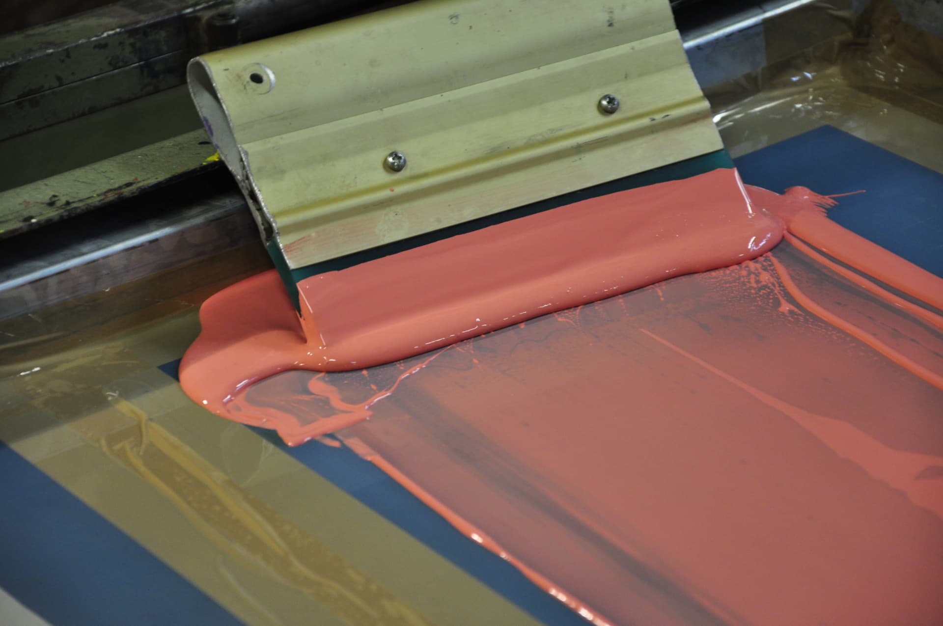 Screenprinting — ink pulled across the screen